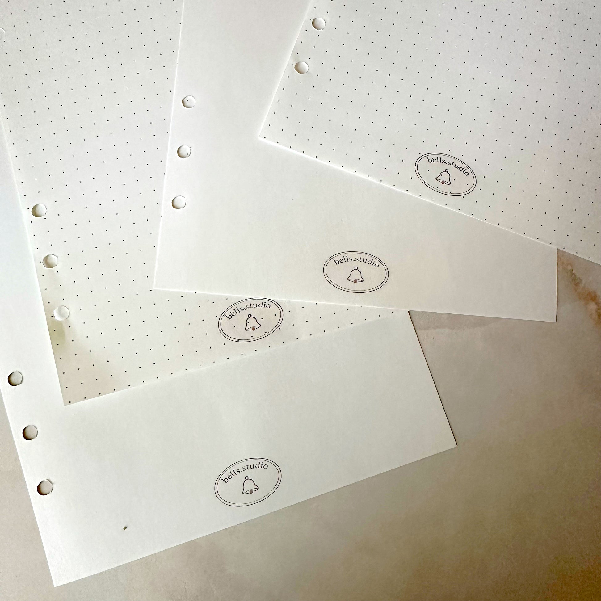 Detail view of premium A5 binder refill pages with 6-hole punching
